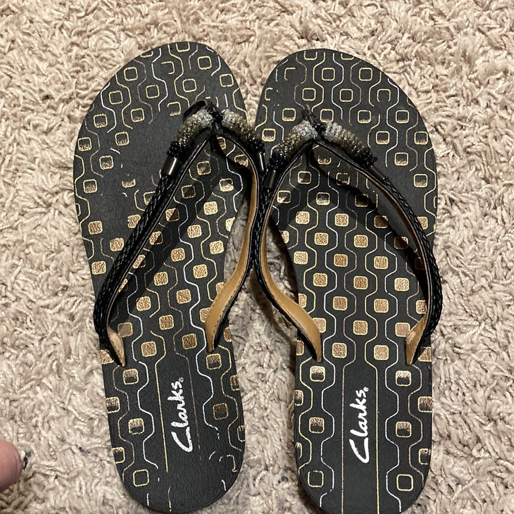 Clark’s flip flops.
